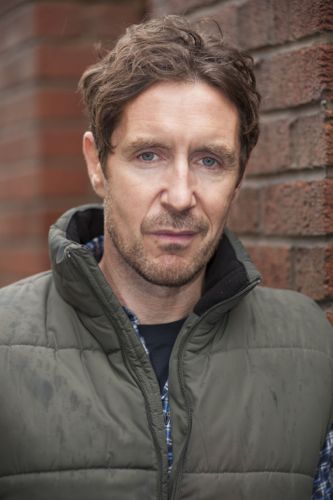 Paul McGann as Phil.