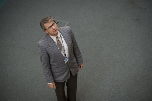 Simon McBurney as Colin Wall.