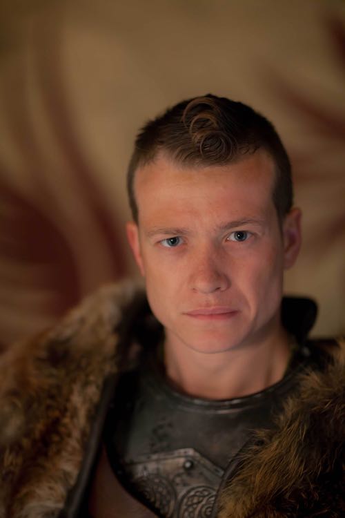 Edward Speleers as Slean.
