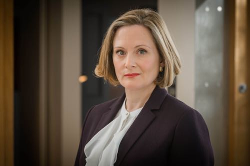 Lucy Robinson as Robyn. 