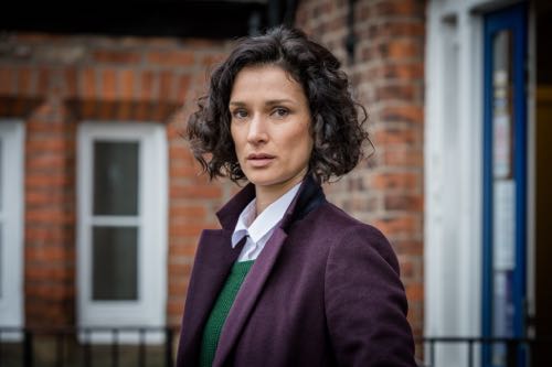 Indira Varma as Nina Suresh.